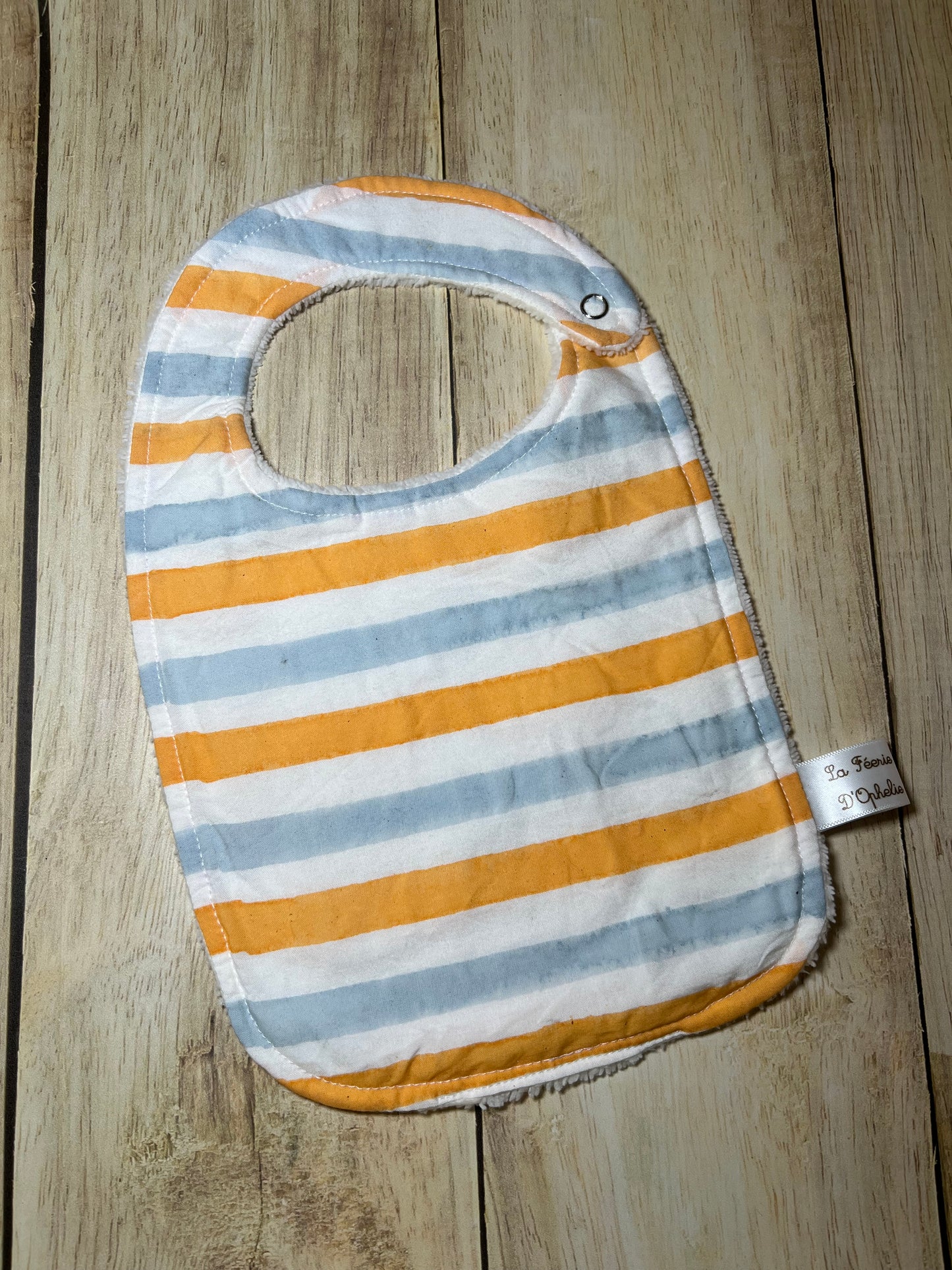 Bavoir jaune et bleu