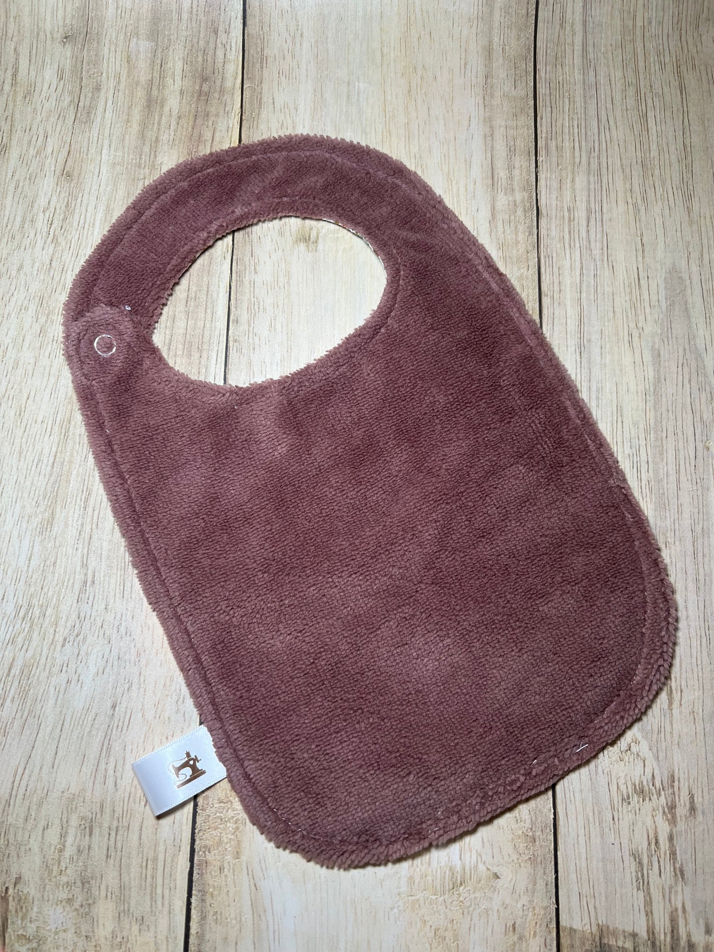 Bavoir fleurs violine