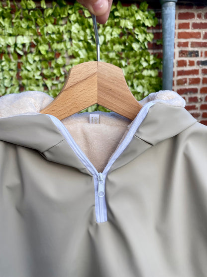 Poncho imperméable beige uni